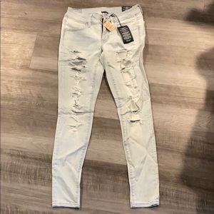 AE Super Stretch light denim holy jeans